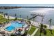 Community pool with a pier and waterfront views at 5130 Brittany S Dr # 505, St Petersburg, FL 33715