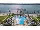 Relaxing pool area with waterfront views and a nearby pier at 5130 Brittany S Dr # 505, St Petersburg, FL 33715