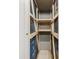 Storage unit with wooden shelves and wire mesh at 5130 Brittany S Dr # 505, St Petersburg, FL 33715