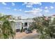 Modern building with parking and lush landscaping at 111 N 12Th St # 1306, Tampa, FL 33602