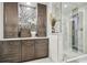 Bathroom featuring dark brown cabinets and marble shower at 111 N 12Th St # 1306, Tampa, FL 33602