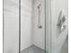 Modern shower with glass enclosure and patterned tile floor at 111 N 12Th St # 1306, Tampa, FL 33602