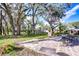 Expansive backyard with patio and mature trees at 12910 Forest Hills Dr, Tampa, FL 33612