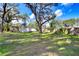 Large backyard with shed and mature trees at 12910 Forest Hills Dr, Tampa, FL 33612