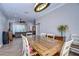 Farmhouse style dining room with large wooden table and access to the living room at 12910 Forest Hills Dr, Tampa, FL 33612