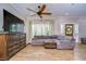 Bright living room with hardwood floors and a ceiling fan at 12910 Forest Hills Dr, Tampa, FL 33612