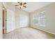 Bedroom with double doors and large window at 18860 Duquesne Dr, Tampa, FL 33647