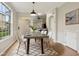 Dining room with concrete table, modern chairs, and stylish rug at 18860 Duquesne Dr, Tampa, FL 33647