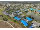 Aerial view of a residential community with a golf course and lakes at 2701 Lancaster Dr, Sun City Center, FL 33573
