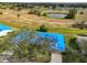 Aerial view of a house with a blue tarp on the roof at 2701 Lancaster Dr, Sun City Center, FL 33573