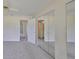 Bedroom with mirrored closet doors, carpeted floors, and neutral walls at 2701 Lancaster Dr, Sun City Center, FL 33573