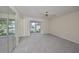 Empty bedroom with large window, mirrored closet, and carpeted flooring at 2701 Lancaster Dr, Sun City Center, FL 33573
