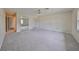 Spacious bedroom with mirrored closet doors and carpeted flooring at 2701 Lancaster Dr, Sun City Center, FL 33573