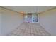 Tiled covered entryway with a stone accent wall and front door at 2701 Lancaster Dr, Sun City Center, FL 33573