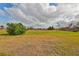Lush green golf course under a cloudy sky at 2701 Lancaster Dr, Sun City Center, FL 33573