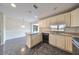 Kitchen with white cabinetry and a breakfast bar open to the dining area at 2701 Lancaster Dr, Sun City Center, FL 33573