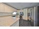 Kitchen with white cabinetry, granite countertops, and stainless steel appliances at 2701 Lancaster Dr, Sun City Center, FL 33573