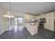 Kitchen with white cabinetry, stainless steel appliances, and breakfast bar at 2701 Lancaster Dr, Sun City Center, FL 33573