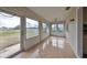 Tiled sunroom with access to the backyard and golf course views at 2701 Lancaster Dr, Sun City Center, FL 33573