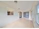 Spacious sunroom with tile floor and access to other rooms at 2701 Lancaster Dr, Sun City Center, FL 33573