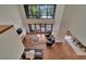 Elevated view of living room, showcasing hardwood floors, leather furniture and access to a deck at 4035 N River View Ave, Tampa, FL 33607