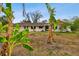 Ranch-style home with a covered porch and mature trees at 4211 Highview Rd, Seffner, FL 33584