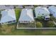 Backyard view showing house, fence and neighboring houses at 442 Bahama Grande Blvd, Apollo Beach, FL 33572