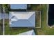 House roof and backyard, showcasing metal roof and fenced yard at 442 Bahama Grande Blvd, Apollo Beach, FL 33572