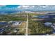 Wide shot of land, including waterway, solar farm, and power plant at 442 Bahama Grande Blvd, Apollo Beach, FL 33572