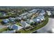 Community overview, featuring canal, houses, and lush greenery at 442 Bahama Grande Blvd, Apollo Beach, FL 33572