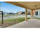 Covered patio with view of canal, pool, and houses at 442 Bahama Grande Blvd, Apollo Beach, FL 33572