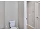 Simple toilet and adjacent hallway at 442 Bahama Grande Blvd, Apollo Beach, FL 33572