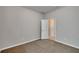 Bedroom with door to bathroom and carpet flooring at 442 Bahama Grande Blvd, Apollo Beach, FL 33572