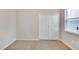 Simple bedroom with double door closet and window at 442 Bahama Grande Blvd, Apollo Beach, FL 33572