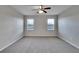 Bright bedroom with carpet and two windows at 442 Bahama Grande Blvd, Apollo Beach, FL 33572