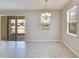 Bright dining area with tile flooring and chandelier at 442 Bahama Grande Blvd, Apollo Beach, FL 33572