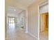 Hallway view of entry with access to living room and bath at 442 Bahama Grande Blvd, Apollo Beach, FL 33572