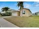 One-story house with attached garage, landscaping, and palm trees at 442 Bahama Grande Blvd, Apollo Beach, FL 33572
