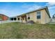House exterior with covered patio and grassy yard at 442 Bahama Grande Blvd, Apollo Beach, FL 33572