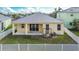 House exterior view with a covered patio and fenced yard at 442 Bahama Grande Blvd, Apollo Beach, FL 33572