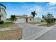 House exterior with a driveway and landscaping at 442 Bahama Grande Blvd, Apollo Beach, FL 33572