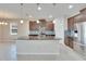 Modern kitchen featuring dark wood cabinets and a stylish backsplash at 442 Bahama Grande Blvd, Apollo Beach, FL 33572