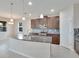 Kitchen island with granite countertop and stainless steel sink at 442 Bahama Grande Blvd, Apollo Beach, FL 33572