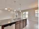 Large kitchen island with granite countertop and double sink at 442 Bahama Grande Blvd, Apollo Beach, FL 33572