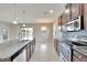 Modern kitchen with stainless steel appliances and granite countertops at 442 Bahama Grande Blvd, Apollo Beach, FL 33572