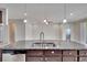 Modern kitchen with stainless steel appliances and granite countertop at 442 Bahama Grande Blvd, Apollo Beach, FL 33572