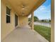 Covered patio with ceiling fan, overlooking canal at 442 Bahama Grande Blvd, Apollo Beach, FL 33572