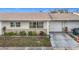 Front exterior view of a charming attached single-Gathering home with a one-car garage at 5316 Buttonwood Dr, New Port Richey, FL 34652