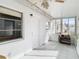 Florida Room with door leading to the home's interior, a window, and tiled floors at 5316 Buttonwood Dr, New Port Richey, FL 34652