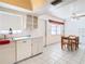 Compact kitchen with white cabinets and modern appliances at 5316 Buttonwood Dr, New Port Richey, FL 34652